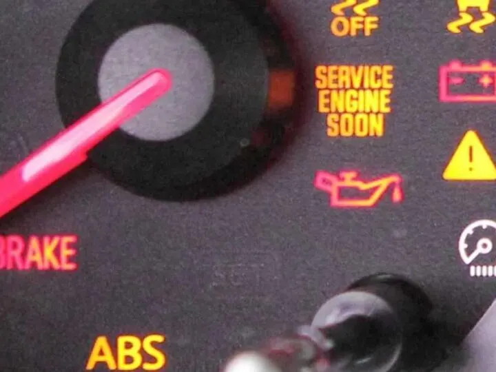 What does the triangle with exclamation point mean in Nissan Altima?